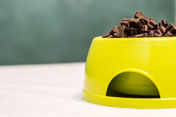 Bowl full of dog food over table 