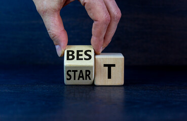Time to best start symbol. Businessman turns a wooden cube with words 'best start'. Beautiful grey background, copy space. Business and best start concept.