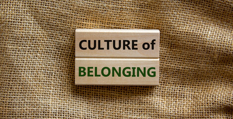 Culture of belonging symbol. Wooden blocks with words 'culture of belonging' on beautiful canvas...