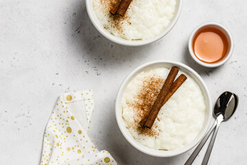 Vegan rice pudding in bowls. Top view, space for text.