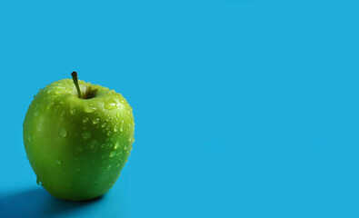 green apple on a blue background