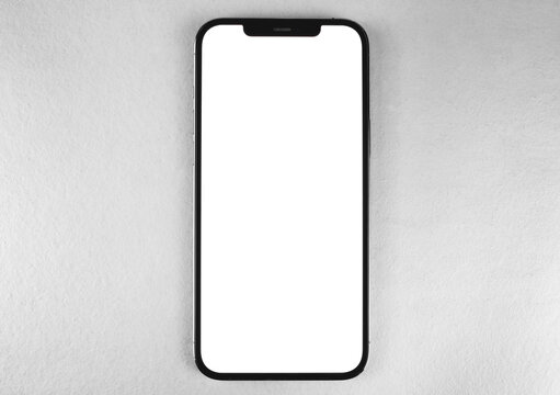 smartphone mockup iPhone 12 Pro Max with blank white screen on grey background, top view. Apple is a multinational technology company. Moscow, Russia - January 14, 2021