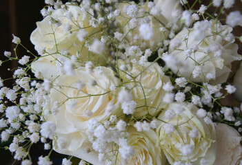 bouquet of white roses on a black background. beautiful floral arrangement