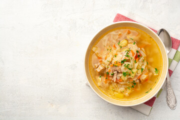Traditional Russian cabbage soup Shchi on concrete background