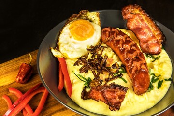 Pork sausages with mashed potato. Bangers and mash pork sausages and mashed potato. Unhealthy and greasy food. Grilled sausage.