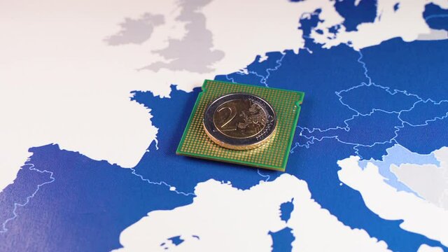 2 euro coin over a CPU on an European Union map, symbolizing the Digital Euro. European and the national central banks of the euro area are exploring the benefits and risks of a digital coin.