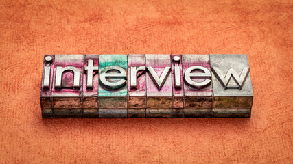 Obraz premium interview word abstract in gritty vintage letterpress metal types, business communication concept