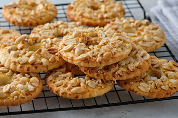 Cookies with peanuts on a black wire rack. Selective focus, closeup.