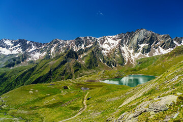 Fototapeta na wymiar Passo Gavia, mountain pass in Lombardy, Italy, to Val Camonica at summer. Lake