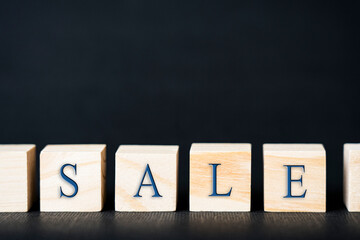 sale word on wooden cubes, space for text on top, tinted image, selective focus