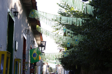old street in the city with brazil flags