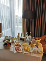 Luxurious breakfast for the newlyweds at the hotel. Breakfast in the room