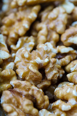 Close-up of a bunch of walnuts, with out of focus background. Vertical view.