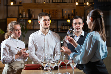 the manager trains the restaurant staff on the rules of customer service