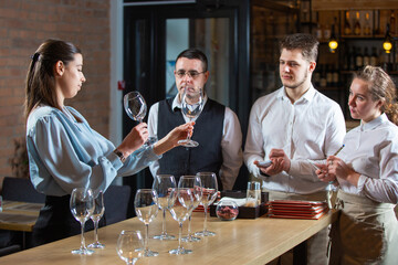 the manager trains the restaurant staff on the rules of customer service