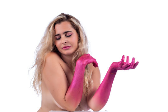 Adult young woman with painted pink hands