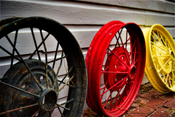 Black, Red, and Yellow Antique Tire Rims 