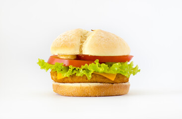 Chicken burger with lettuce, tomato, and cheddar cheese. 