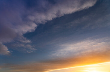 Naklejka na ściany i meble Beautiful bright sunset sky with colorful clouds. Nature sky background. Dramatic sunset.
