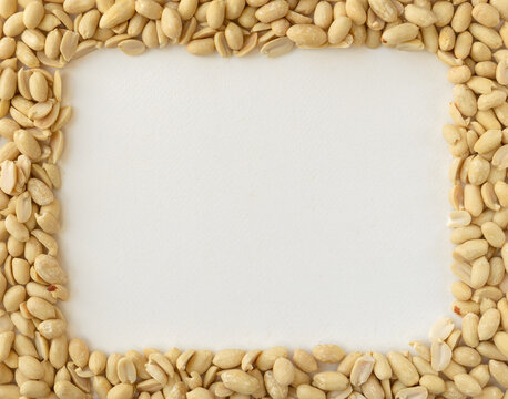 Frame made of Peanuts isolated on white background. Top view.