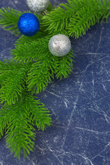 Christmas fir tree with decorations at blue background