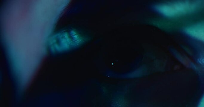 Abstract visuals projected over human eye macro close up