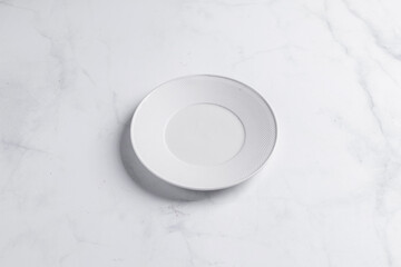 Empty white plate or dish on stone table - light Vintage Filter