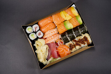 Sushi with wasabi on black background.