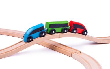 toy train made of wood on a wooden bridge