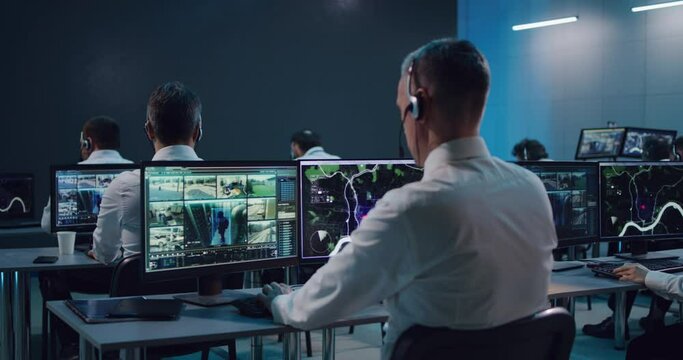 Male trader using computer in stock exchange office