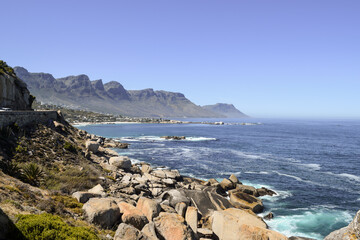 Rocks, the sea and Twelve Apostles Mountain Range in the background. Cape Town, South Africa.