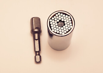 Universal socket wrench and adapter.