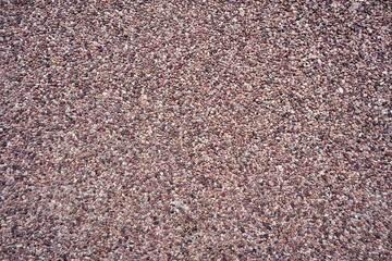 Decorative exterior coating of warm colored marble crumb close-up