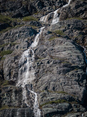 Fototapeta na wymiar Natural waterfalls created by glacier melts in Alaska
