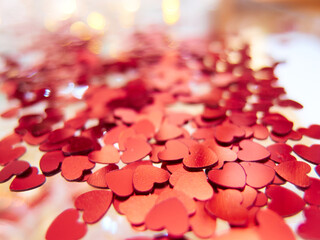 hearts confetti on the golden background