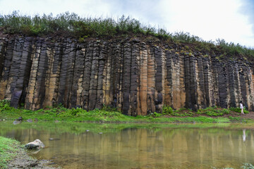 Terracotta columnar basalt columns on the tropical island of Penghu Taiwan. Geological lava plateau.