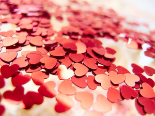 hearts confetti on the golden background