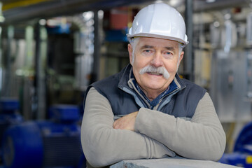 experienced senior engineer in protective helmet