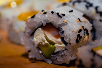 close-up of sushi food on wooden base with dark background for valentine's day dinner with selected focus cordoba argentina