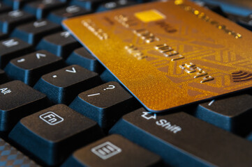Closeup image of keyboard and credit card. Online payment and business concept