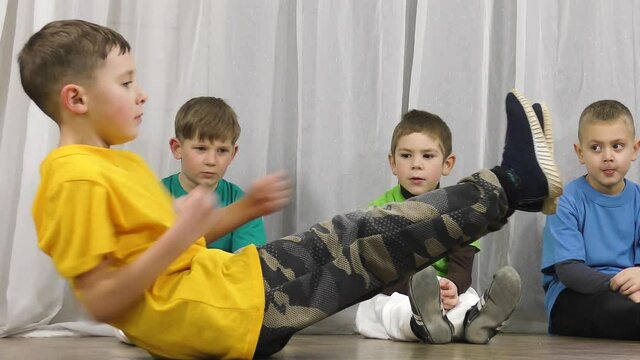 The athlete hits punches and holds his feet above the floor