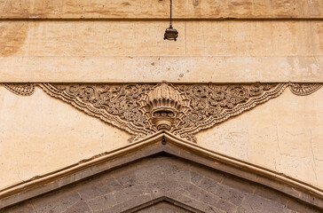 Vijayapura, Karnataka, India - November 8, 2013: Gol Gambaz Mausoleum. Closeup of beige stone...