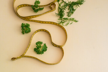 Diet concept on yulow background with measuring tape isolated