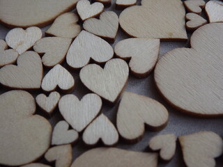 Obraz premium valentine's day greeting card-wooden hearts on a gray suede background. High quality photo