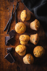 Vanilla muffins. Sweet cupcakes with chocolate and vanilla pods.