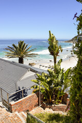 Fototapeta premium Staircase passing between the houses and leading to the sea in Clifton Beach, Cape Town, South Africa.