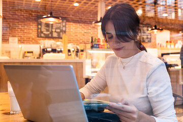 Woman reading a book in a coffee shop