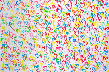 Fototapeta na wymiar Bright colorful pattern of many hearts.Background for decoration and design.Happy Valentine's Day.The concept of celebration and love