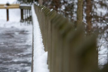 snow covered fence