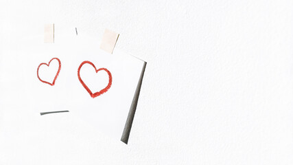 Two images of a red heart on the wall.Happy Valentine's Day.Love, friendship, and a declaration of love.A minimal, stylish holiday concept.copy space